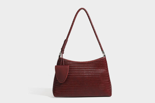 Woven-texture hobo shoulder bag in brown with braided top handle, adjustable crossbody strap, front flap pocket, and, detail
