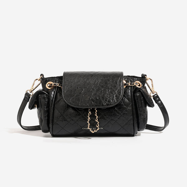 Compact quilted crinkle-finish flap bag with gold-tone chain strap and decorative chain closure detail, front view