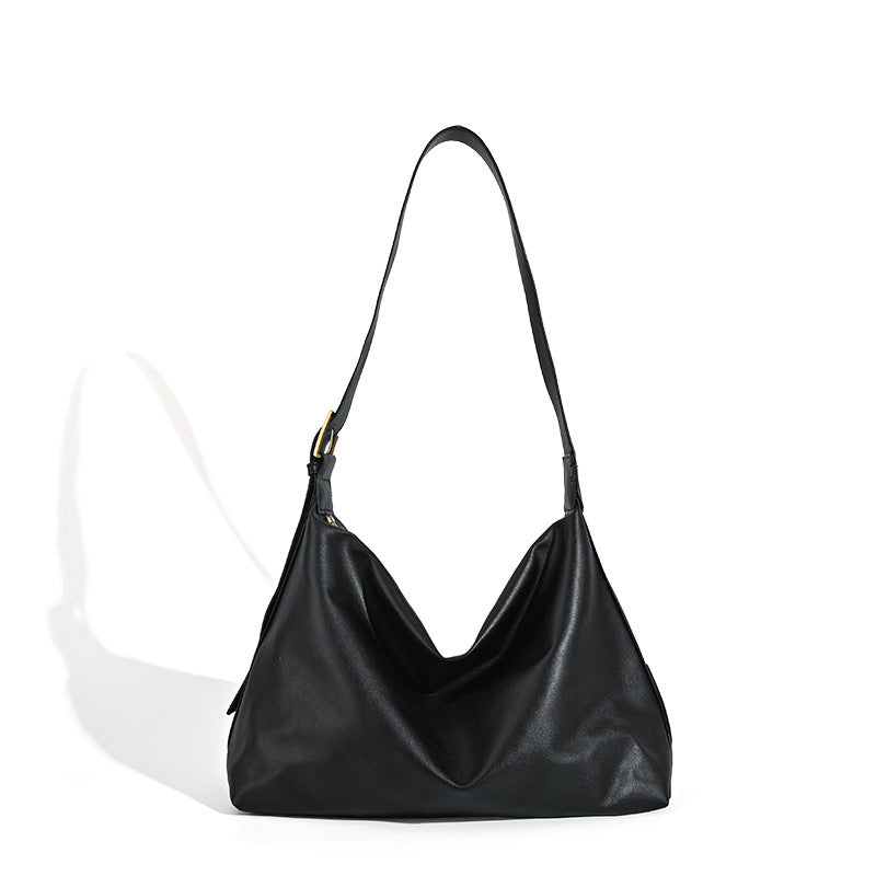 Large slouchy hobo shoulder bag in smooth black leather-look finish with gold-tone buckle hardware and adjustable strap