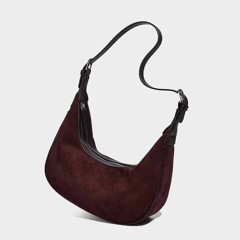 Crescent hobo shoulder bag in matte suede-look finish with black trim and adjustable strap, detail view 8