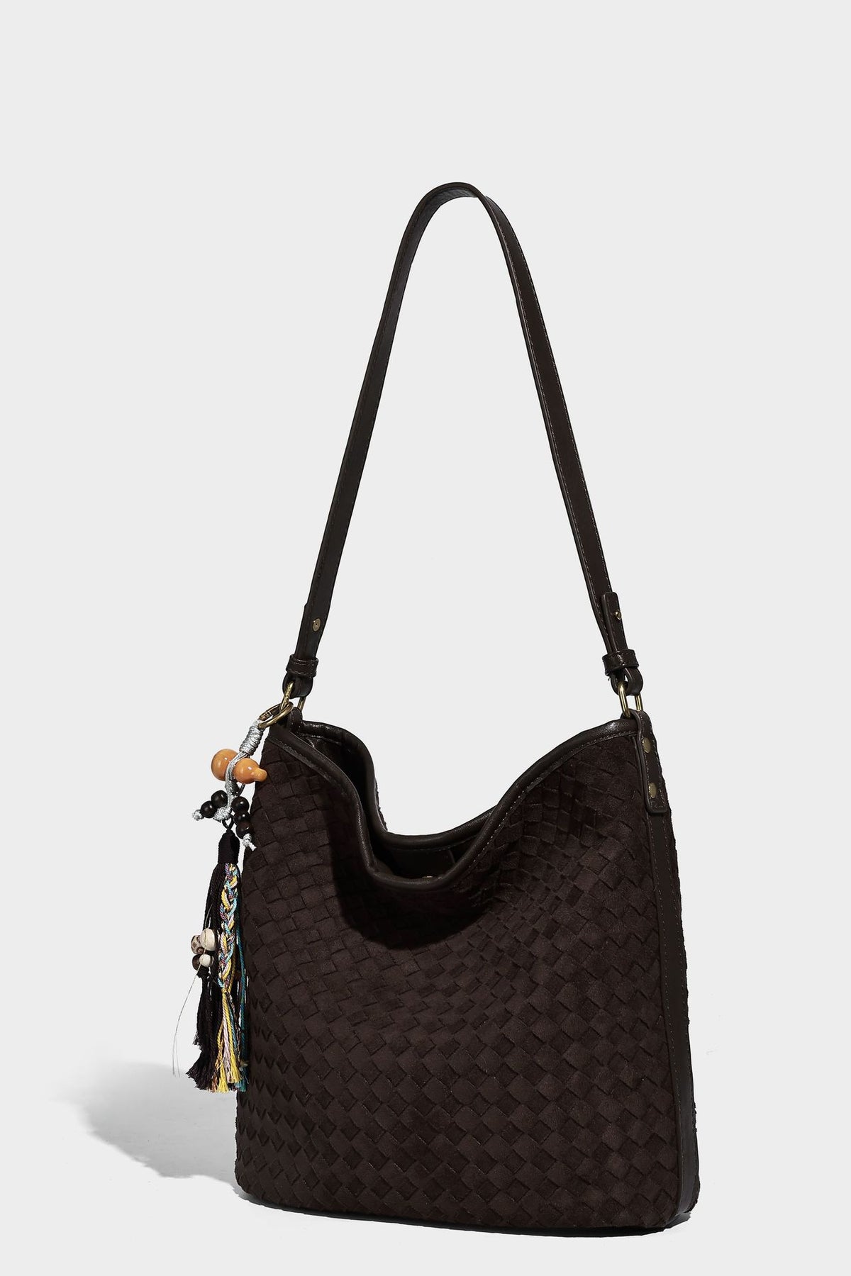 Dark chocolate woven texture hobo shoulder bag with multicolor tassel-and-bead charm and long adjustable strap, detail view