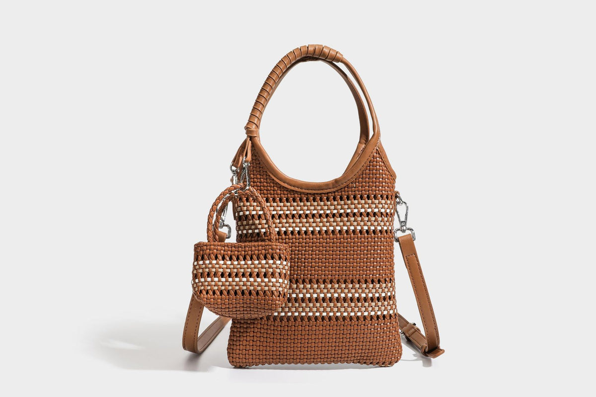 Color-block woven tote bag with rounded leather-look handles, detachable crossbody strap, and matching mini clip-on pouch in