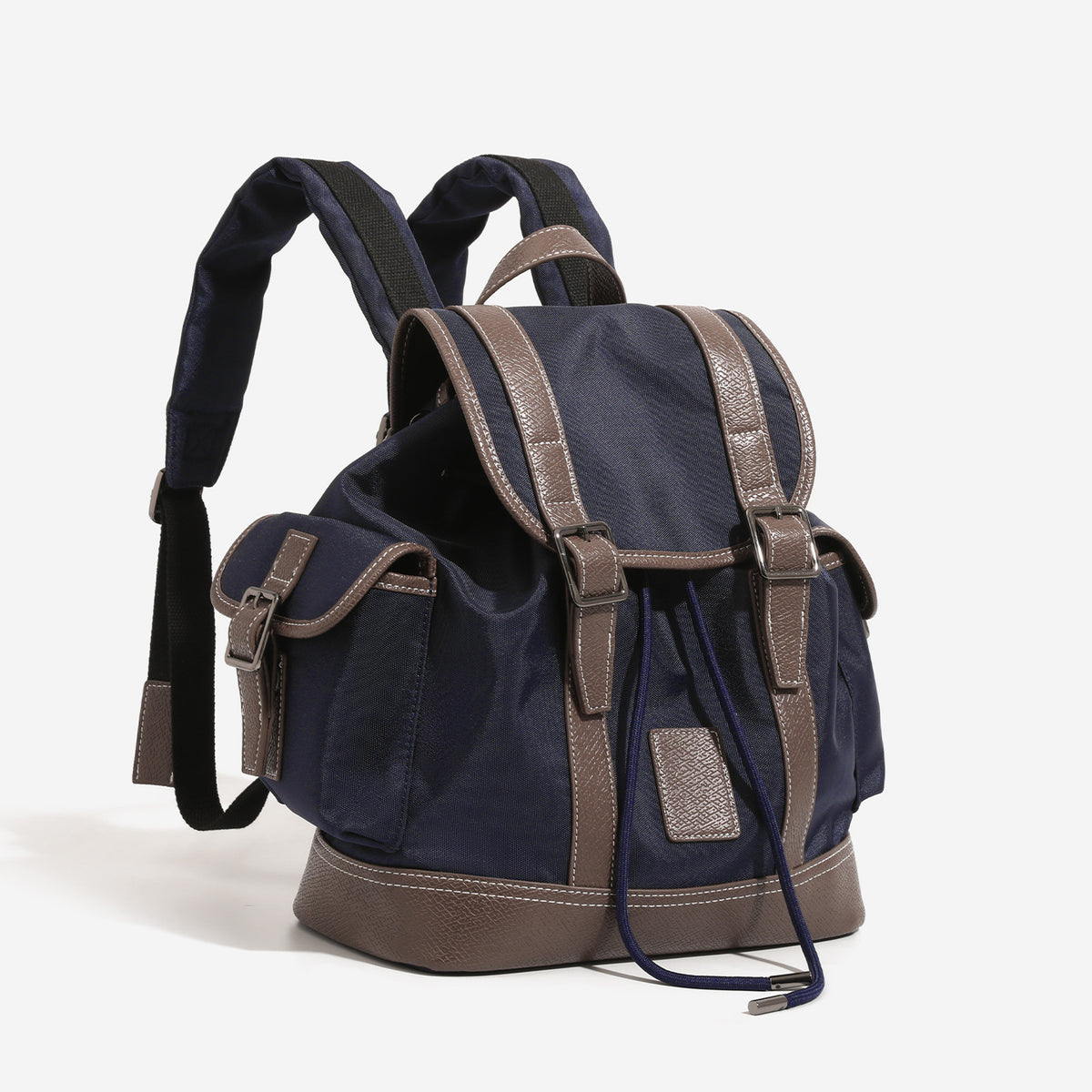 Deep navy canvas backpack with brown textured leather-look trim, drawstring flap closure, buckle-strap front detail, and