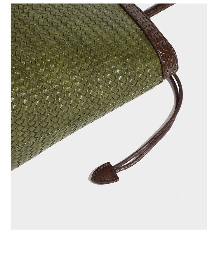 Woven tote bag with braided shoulder straps, drawstring closure, and dangling metal-and-bead charm, detail view 28