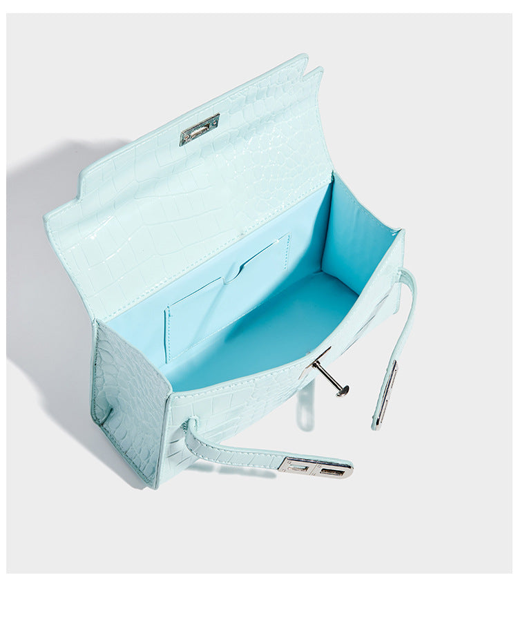 Compact structured flap satchel with glossy crocodile-embossed leather-look finish, silver-tone turn-lock hardware, and