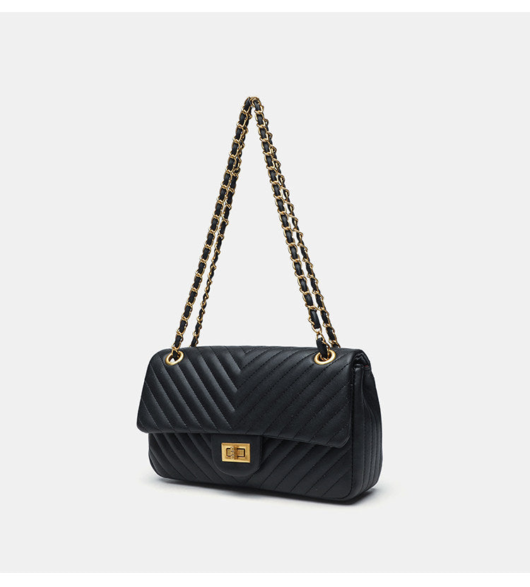 Structured quilted flap bag with gold-tone chain strap and turn-lock closure, detail view 8