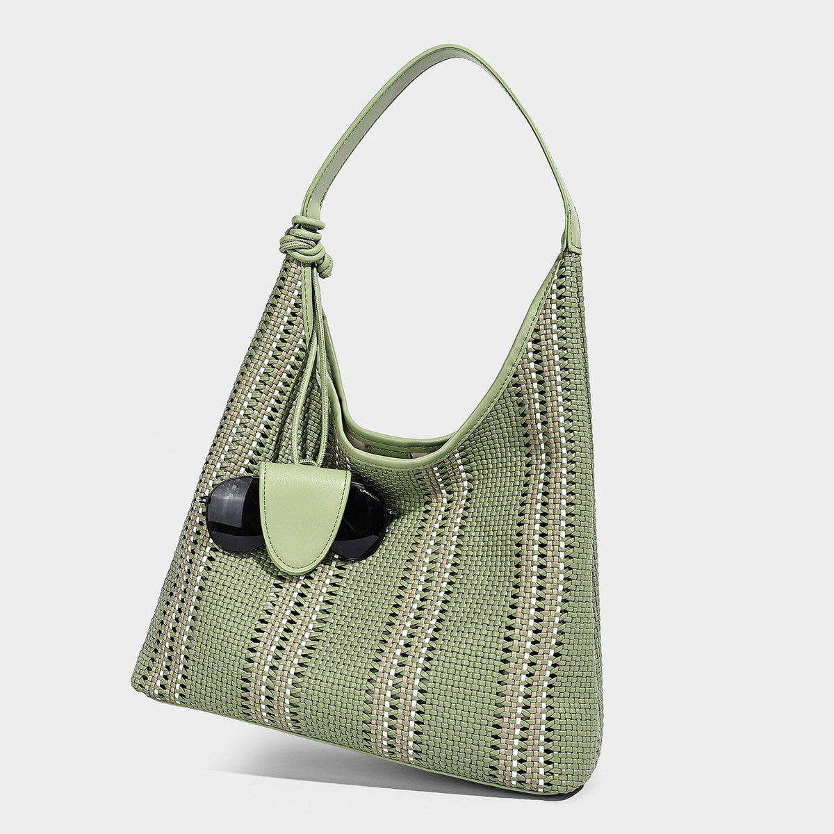 Woven striped slouch shoulder tote bag with knotted strap and attached front flap pouch, detail view 6