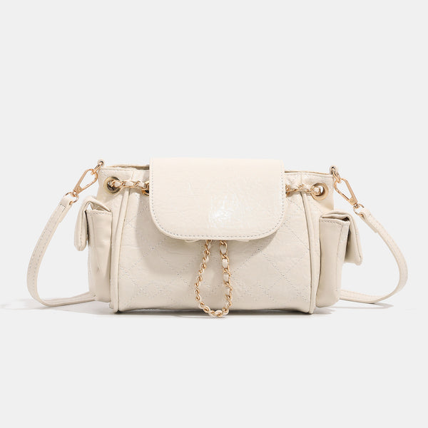 Small quilted leather-look flap bag with gold-tone chain strap and diamond stitch pattern, detail view 7