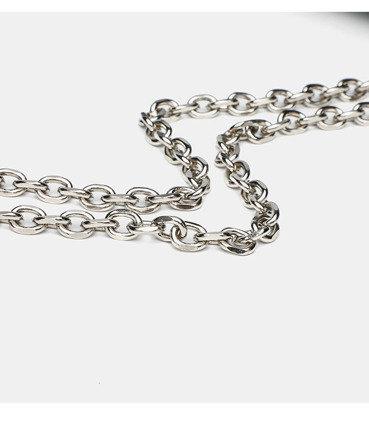Structured rectangular flap crossbody bag with rhinestone bow and silver chain strap in pebbled finish, detail view 17