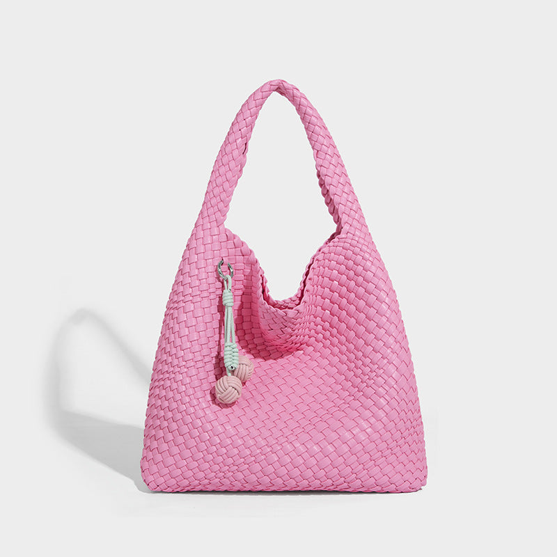 Soft hand-woven slouchy hobo tote bag with knotted tassel charm and single looped shoulder strap, detail view 13