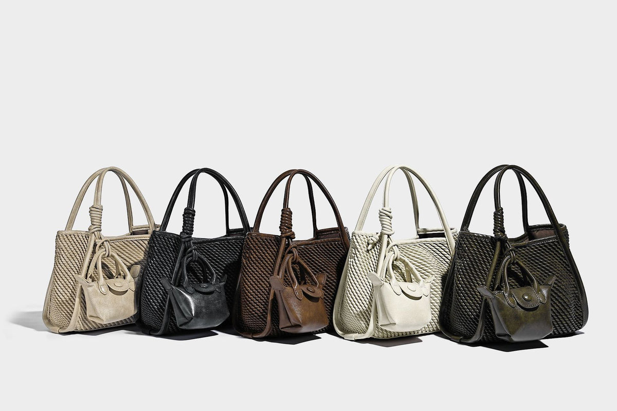 Large structured woven rope-texture tote bag with smooth leather-look trim, knotted dual top handles, detachable mini front