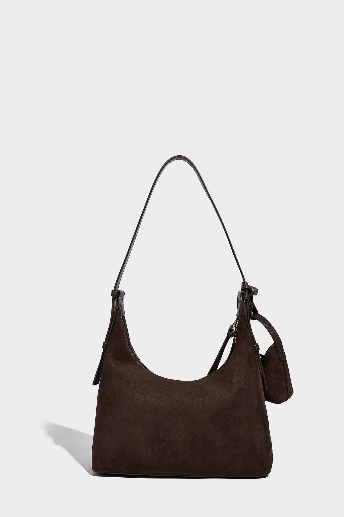 Dark brown suede-look hobo shoulder bag with top zip closure, adjustable strap, and small detachable mini pouch, detail view