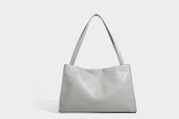 Structured rectangular shoulder tote bag with smooth leather-look finish, long double straps, and gold-tone gourd emblem on