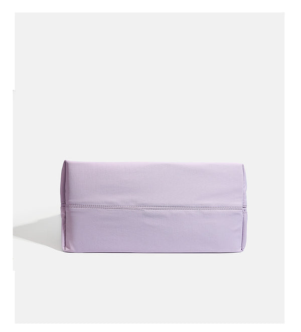 Large soft nylon tote bag with long double handles and zippered top in lavender, detail view 13