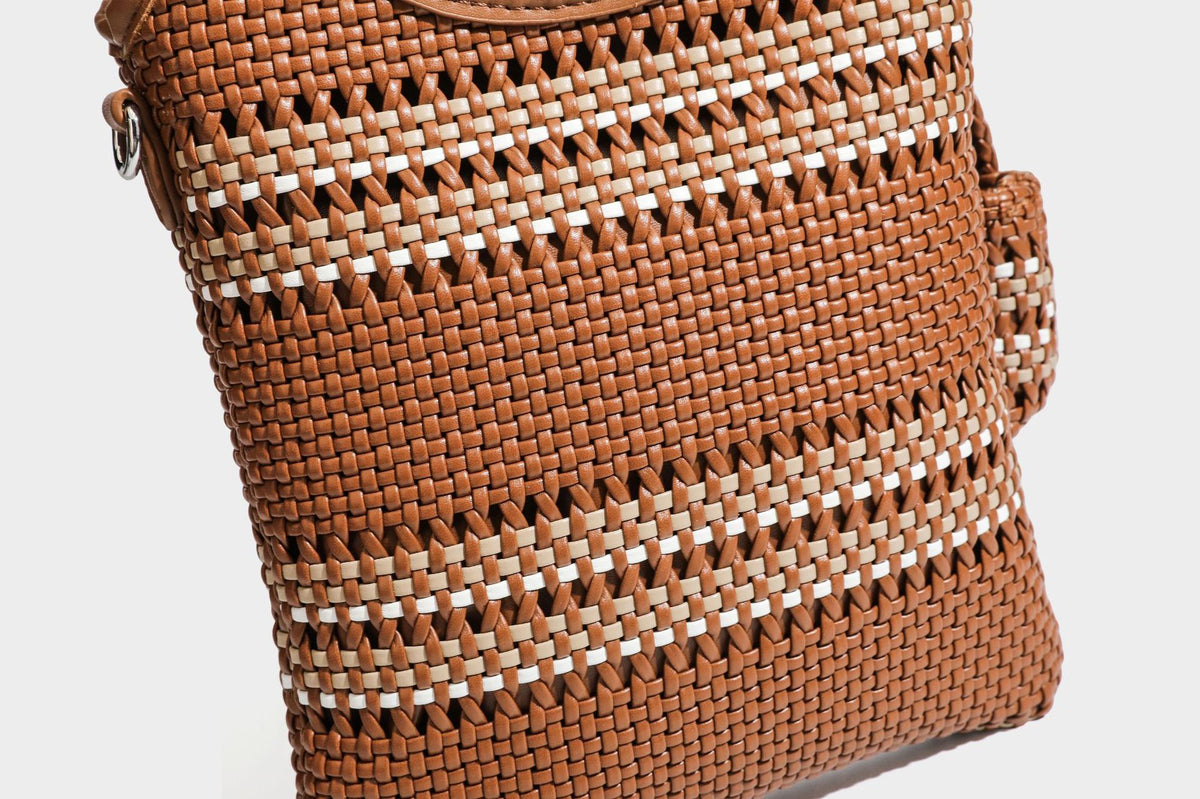 Color-block woven tote bag with rounded leather-look handles, detachable crossbody strap, and matching mini clip-on pouch in