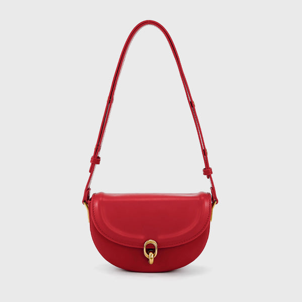 Mini black leather-look saddle bag with gold-tone carabiner clasp and adjustable shoulder strap, detail view 4