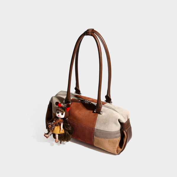 Patchwork suede-look barrel shoulder bag in brown, rust, tan, beige, and gray panels with double leather-look straps and