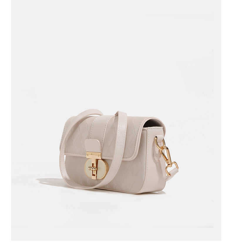 Compact rectangular quilted flap crossbody bag with gold-tone turn-lock closure and chain strap, detail view 13