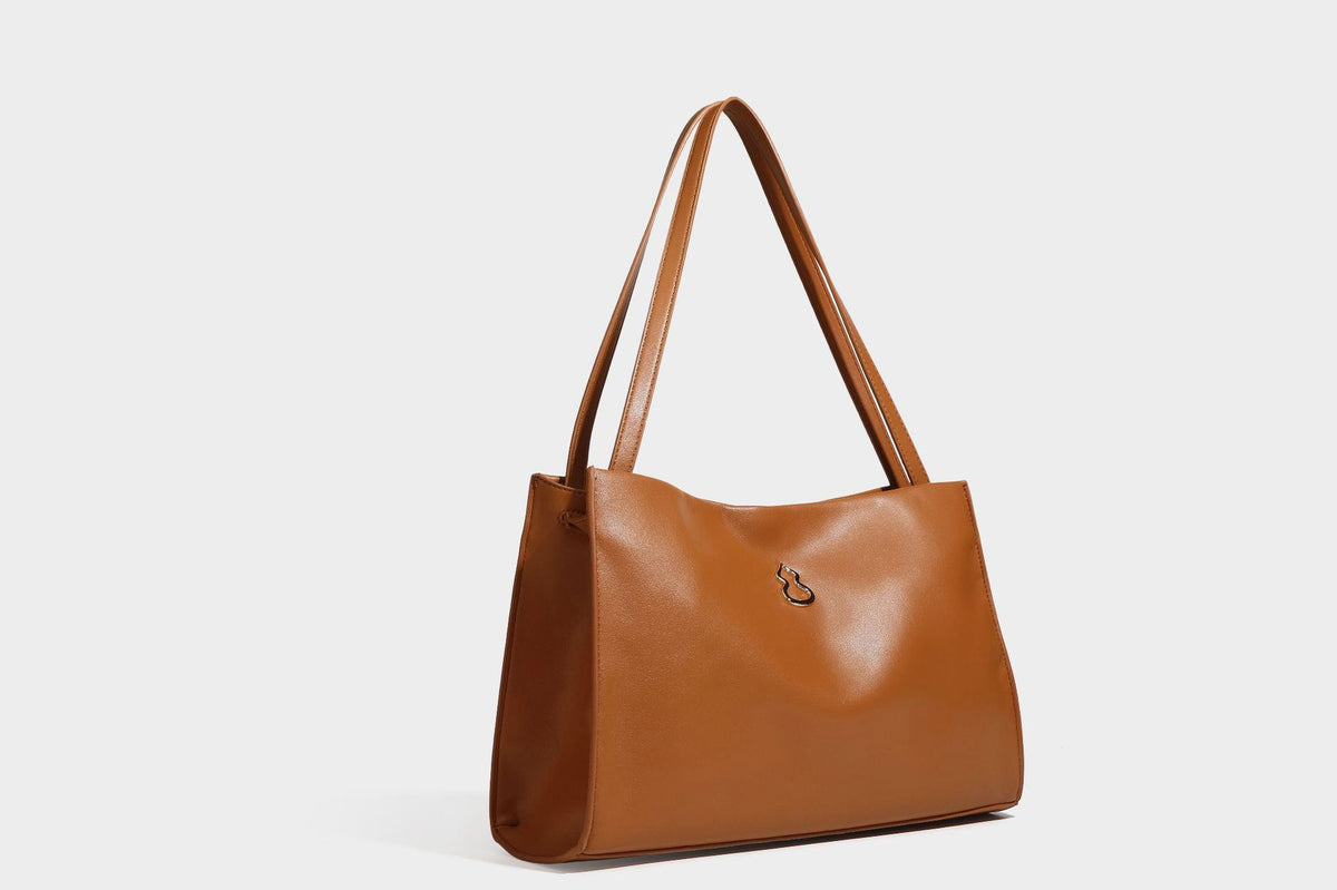 Structured rectangular shoulder tote bag with smooth leather-look finish, long double straps, and gold-tone gourd emblem on