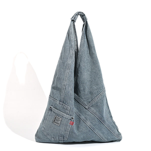 Washed denim slouch tote bag with patch pocket and contrast stitching, detail view 5