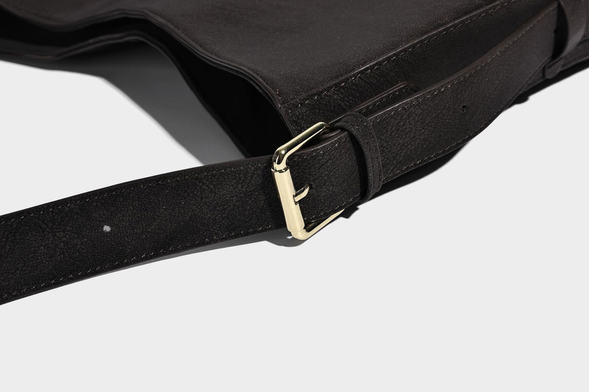 Large slouchy hobo shoulder bag in matte leather-look finish with adjustable strap and gold-tone bar hardware, detail view 25
