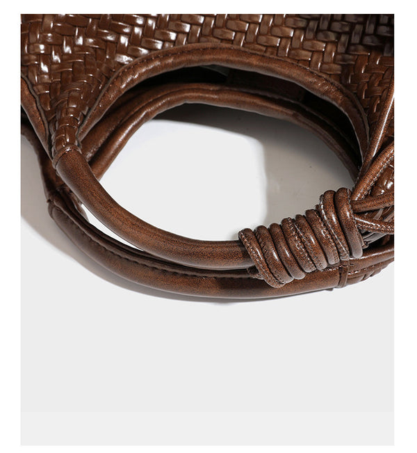 Woven leather-look tote bag in mocha brown with knotted top handle, front flap pocket, and detachable crossbody strap with