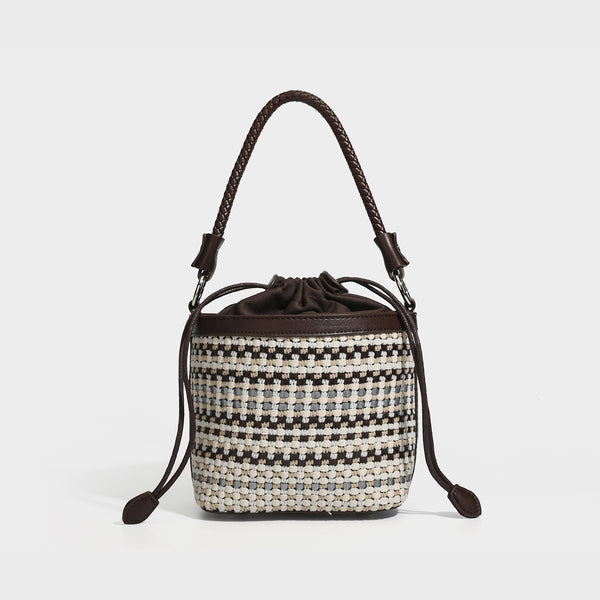 Small structured woven checker bucket bag with braided top handle, drawstring closure, and silver-tone hardware in black