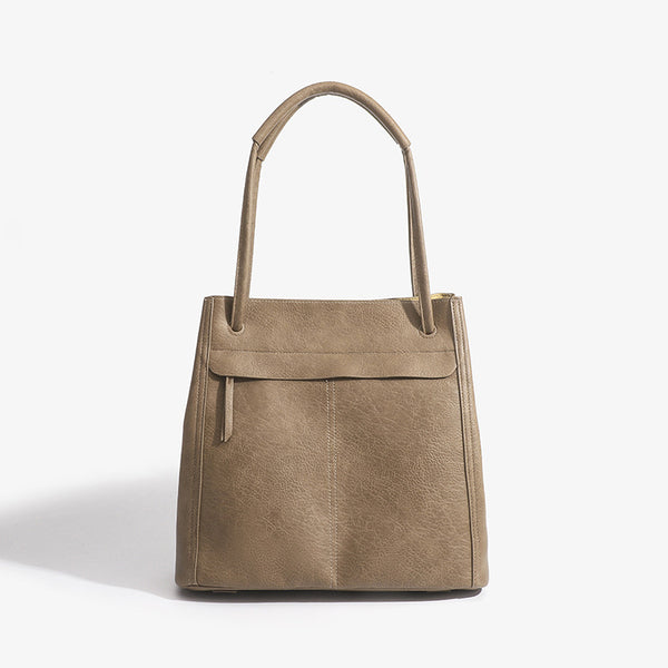 Retro structured matte leather-look tote bag in camel with front flap pocket, tassel pull, and double top handles, front view
