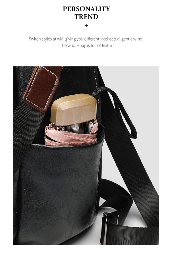 Structured black leather-look convertible backpack handbag with brown contrast trim, buckle front pocket, double-zip top