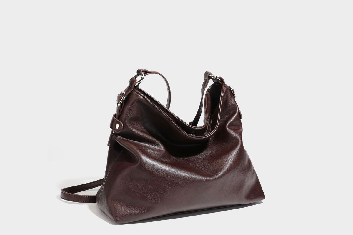 Large slouchy hobo shoulder bag in dark brown with smooth leather-look finish, adjustable strap, and silver-tone hardware