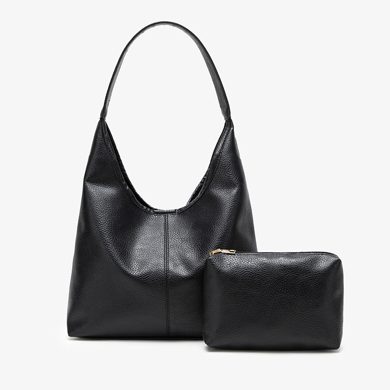Large slouchy hobo shoulder bag in pebbled matte leather-look finish with single flat strap, detail view 4