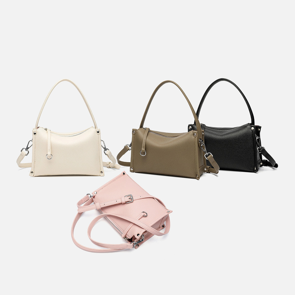 Small structured pebbled-finish convertible bag with silver corner studs, zip top, and detachable shoulder strap, detail view
