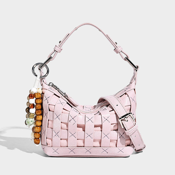 Small woven convertible shoulder bag with top zipper, silver-tone hardware, and detachable crossbody strap, detail view 7
