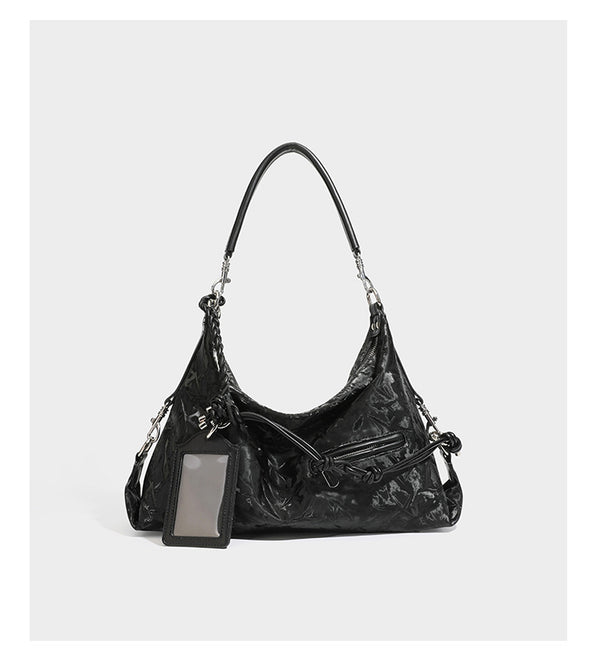 Slouchy hobo shoulder bag in crinkled metallic brown leather-look finish with braided rope knots, silver-tone hardware