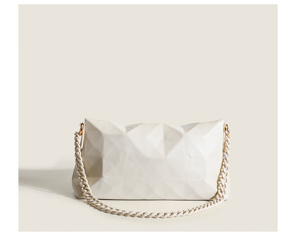Cream white rectangular flap shoulder bag with geometric faceted surface and chunky tone-on-tone chain strap with gold-tone