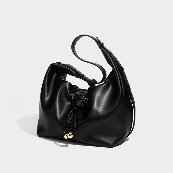 Slouchy hobo bag with smooth leather-look finish, drawstring cinch closure, and gold-tone bead hardware, detail view 4