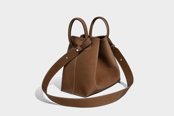 Small structured matte pebbled tote bag with twin top handles and removable zip pouch, detail view 31