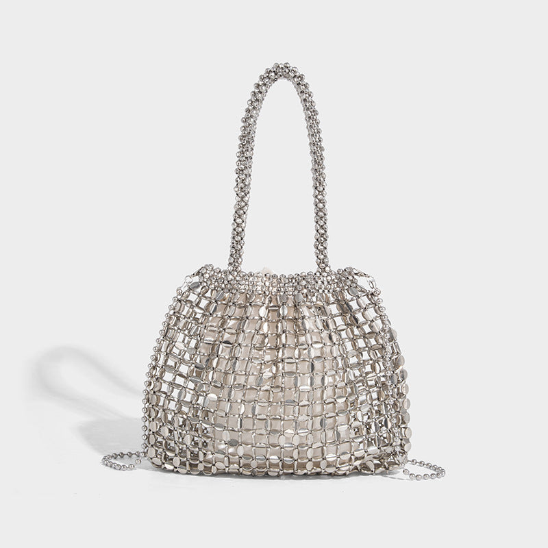 Silver beaded mesh bucket bag with dual looped bead handles and detachable long chain strap, open-top bucket silhouette with