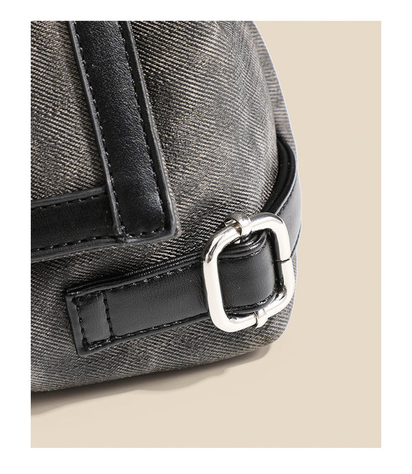 Washed leather-look shoulder tote bag with silver butterfly emblem and buckle hardware, detail view 14