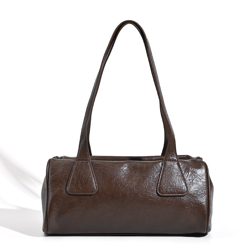 Glossy leather-look barrel shoulder bag with zip closure and top handles, detail view 5
