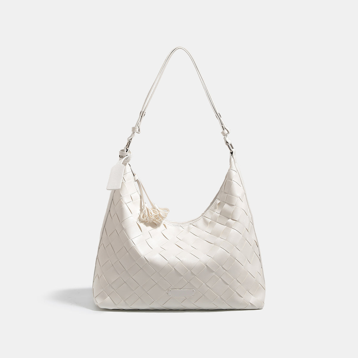 Large woven checker hobo shoulder bag with slim strap, silver-tone hardware, and braided tassel zipper pull, detail view 6