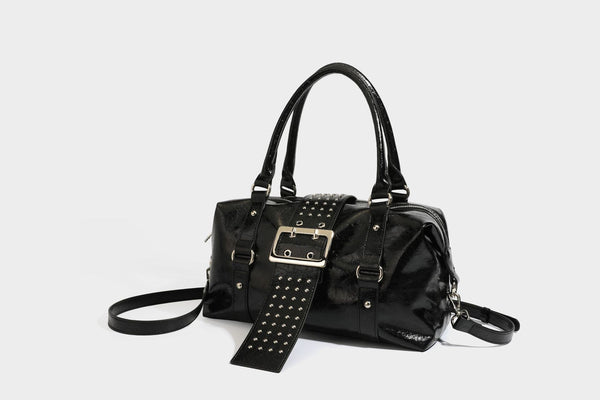 Glossy crinkled barrel handbag with silver stud buckle strap and detachable shoulder strap, detail view 31