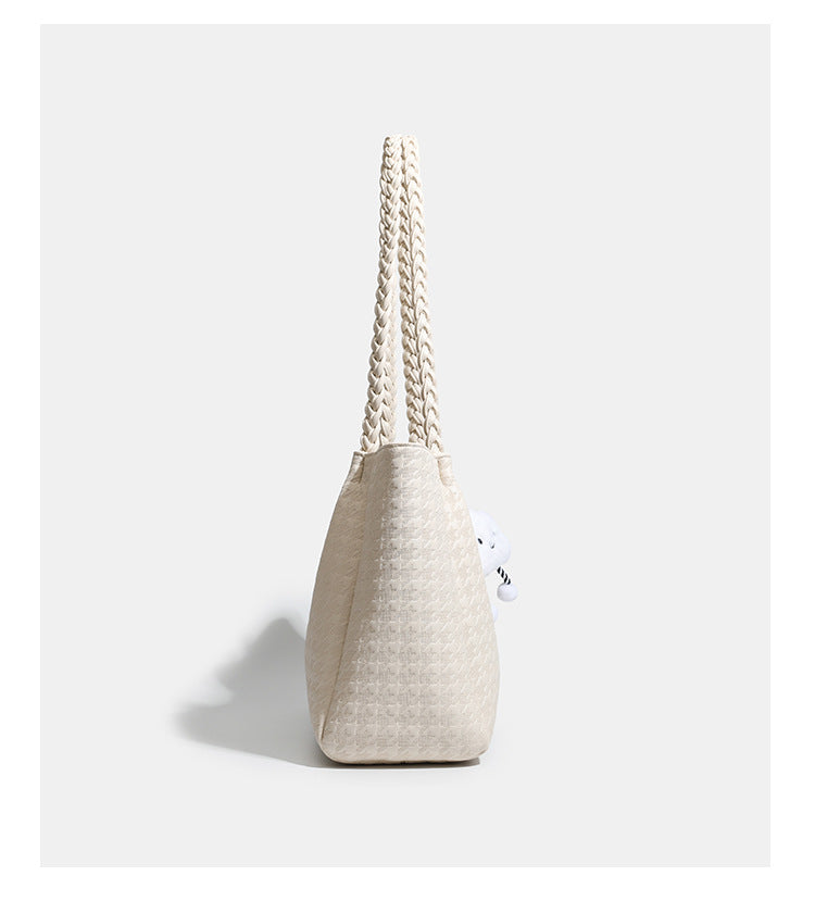 Structured geometric-embossed tote bag with braided shoulder straps and gold-tone hardware in ivory, detail view 10