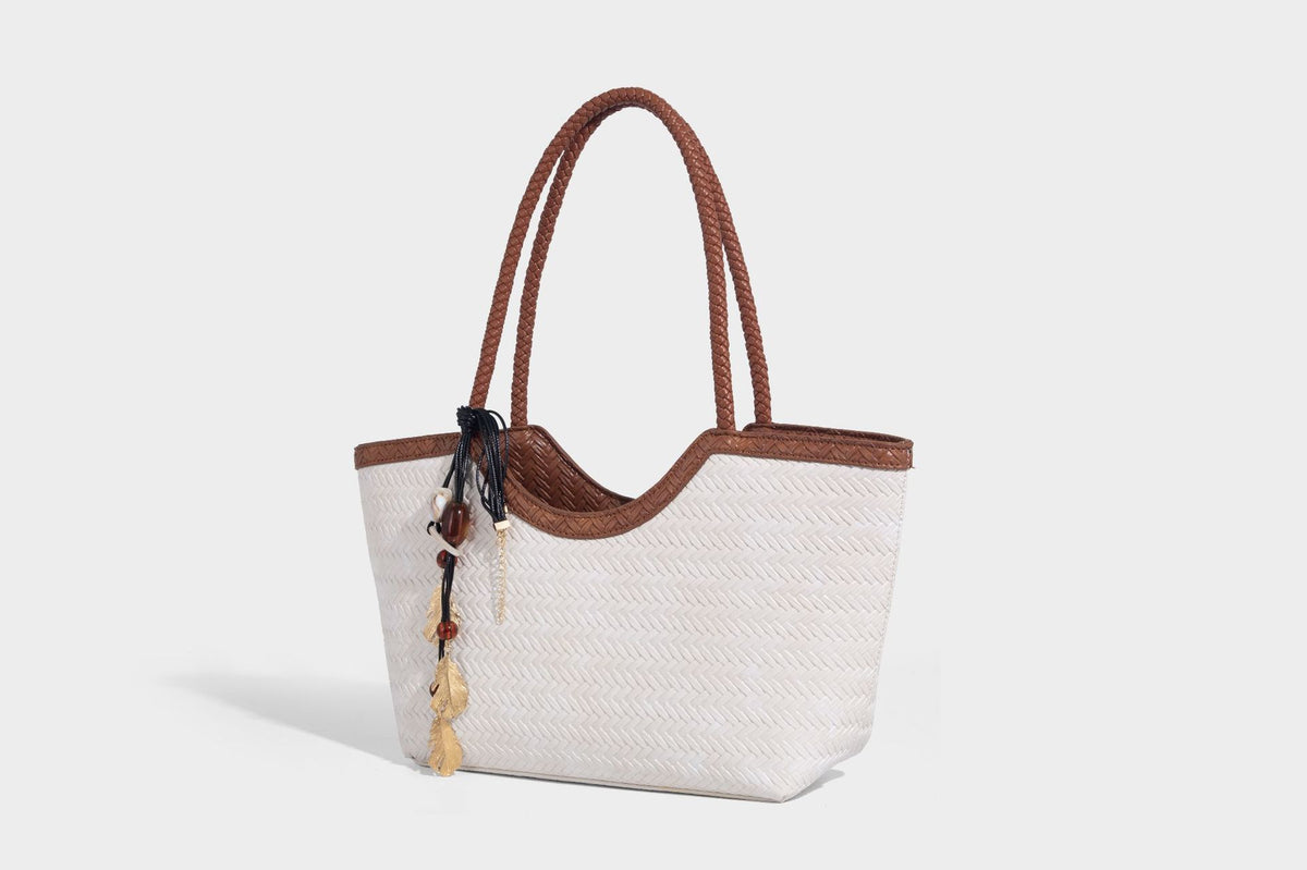 Large open-top woven tote bag with contrasting braided double handles and matching drawstring pouch, detail view 22