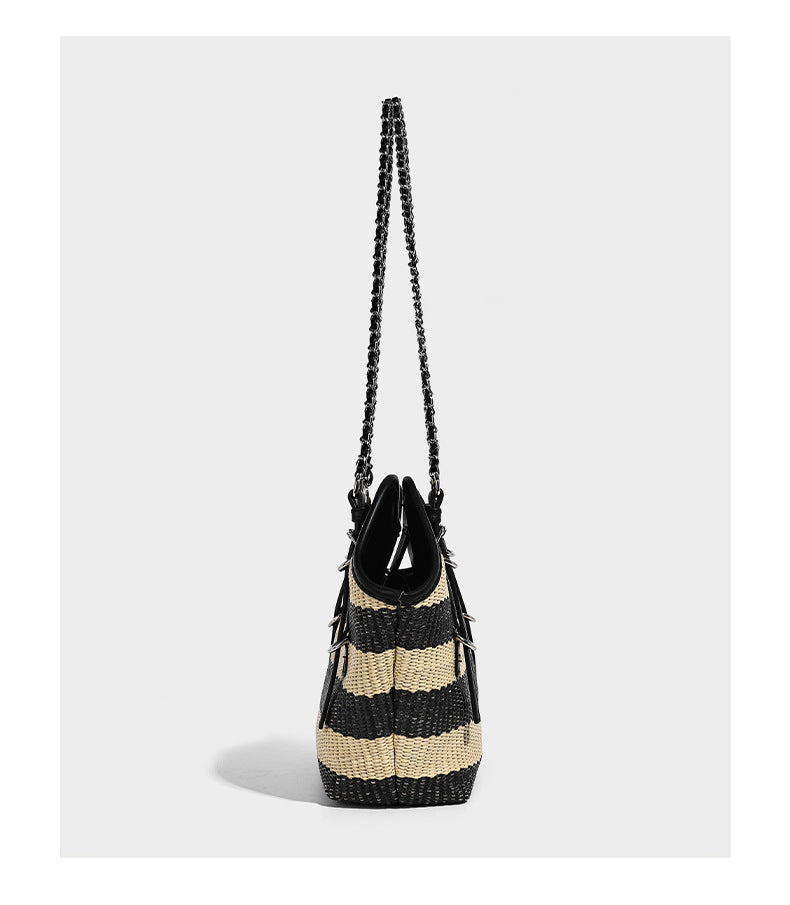 Black and natural striped woven tote bag with chain shoulder strap and silver-tone turn-lock hardware, detail view 8