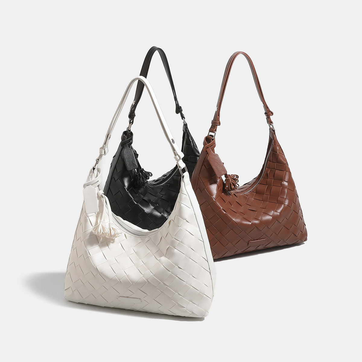 Large woven checker hobo shoulder bag with slim strap, silver-tone hardware, and braided tassel zipper pull, detail view 2