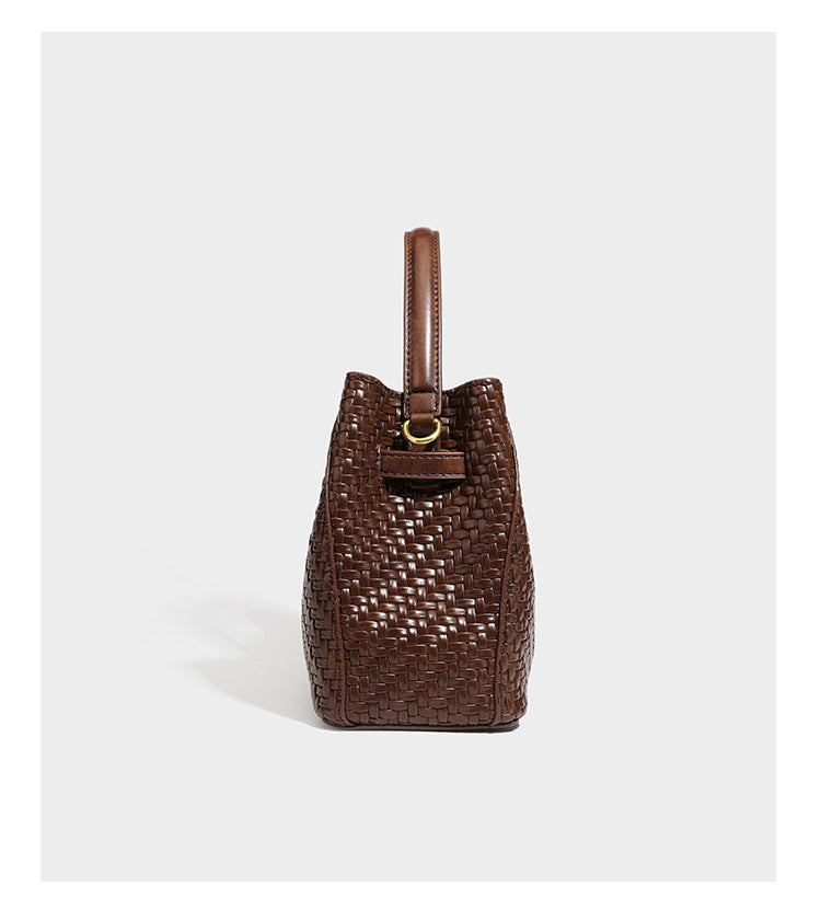 Structured woven leather-look bucket bag with gold-tone turn-lock hardware and detachable shoulder strap, detail view 14