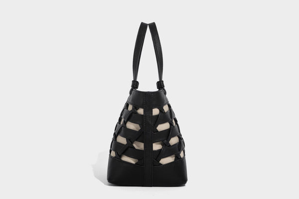 Structured woven lattice tote bag with cream lining, dual top handles, detachable crossbody strap, and silver-tone hardware