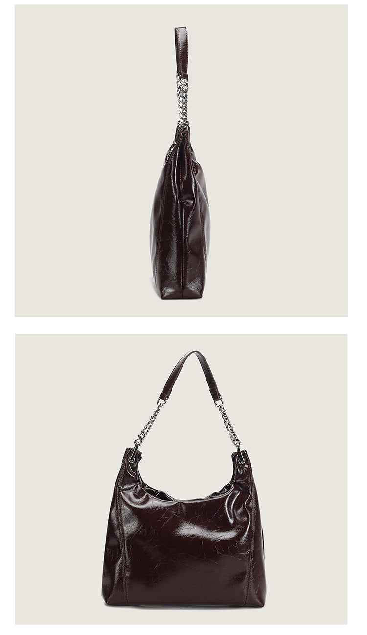 Glossy crinkled leather-look slouchy hobo bag with silver chain-and-leather shoulder strap and open top, detail view 10