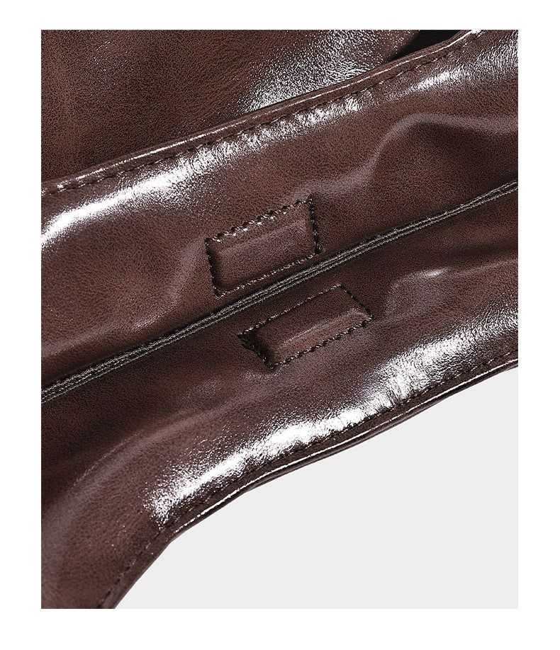 Glossy oil-wax leather-look open-top tote shoulder bag with embossed circular logo and long double straps, detail view 13